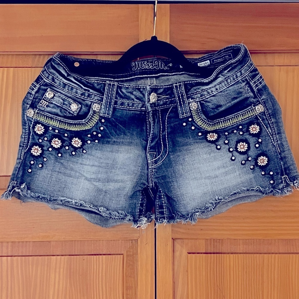 MISS ME. Blue short denim shorts with rhinestones and pattern. Size 27